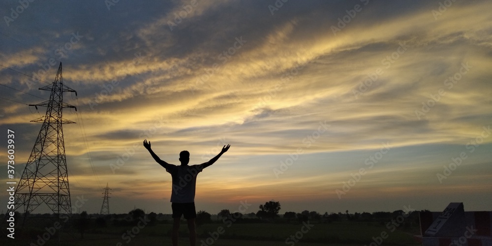 Fototapeta premium silhouette of a man in the sunset