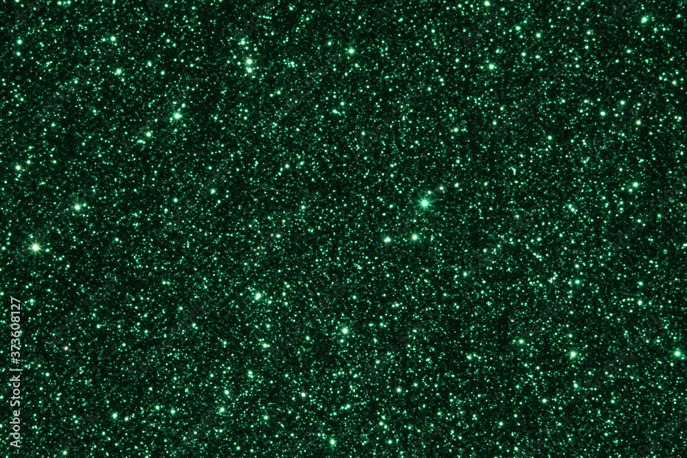Green Sparkling Lights Festive background with texture. Abstract Christmas twinkled bright bokeh defocused and Falling stars. Winter Card or invitation Green Sparkling Lights Festive background with texture. Abstract Christmas twinkled bright bokeh defocused and Falling stars. Winter Card or invitation