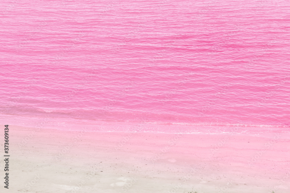 Sea water and pink sand background