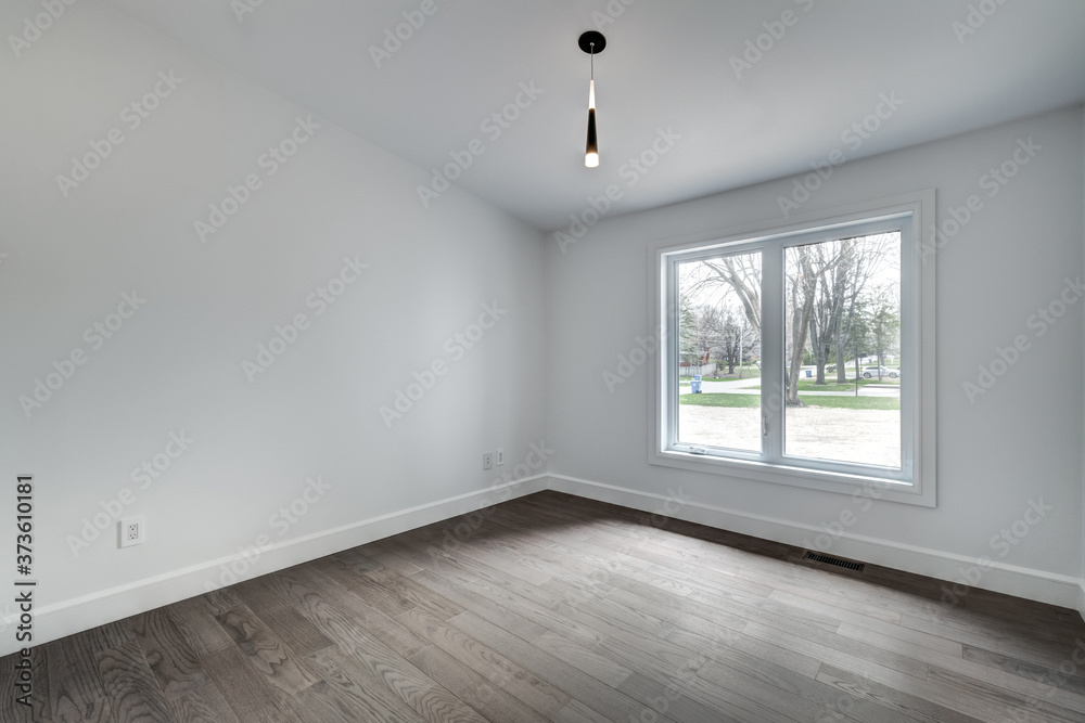 Obraz premium New big luxury modern house in Montreal's suburb partially furnished with backyard, empty rooms, closets, basement and garage