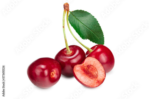red cherry fruit with green leaf isolated on white background