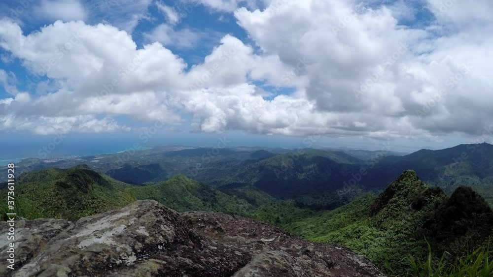 Time lapse of clouds moving across a rain forest in Puerto Rico with the beach in the distance. Time lapse of clouds moving across a rain forest in Puerto Rico with the beach in the distance.
