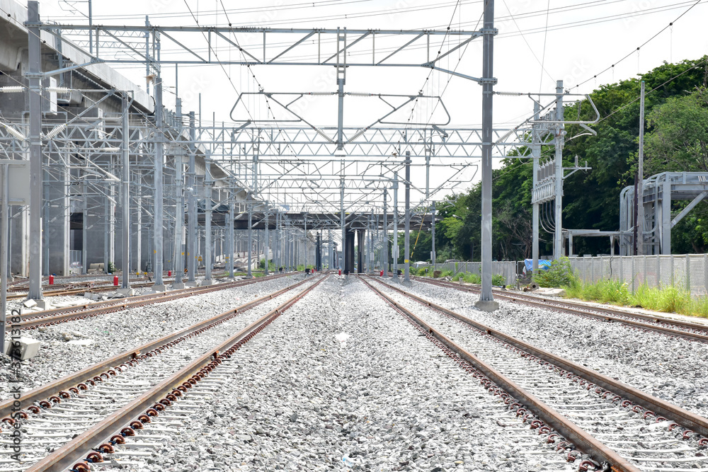 Fototapeta premium New Railroad tracks let the train run through with nature background, Selective focus with shallow depth of field.