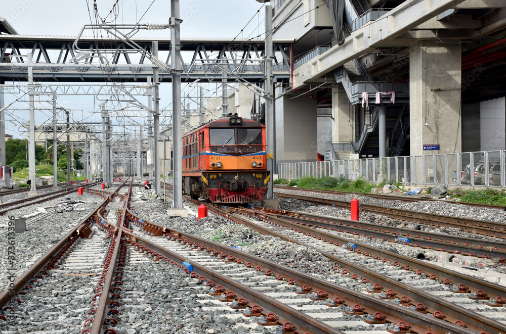 Trains running on the train tracks to the station in Thailand. Select focus with shallow depth of field. Trains running on the train tracks to the station in Thailand. Select focus with shallow depth of field.