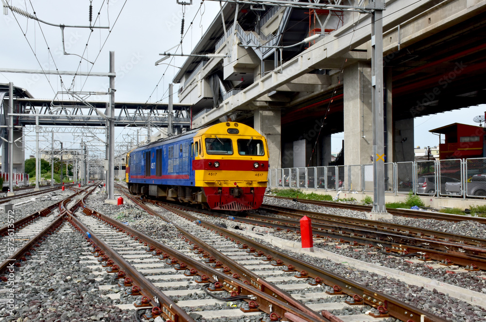 Trains running on the train tracks to the station in Thailand. Select focus with shallow depth of field.