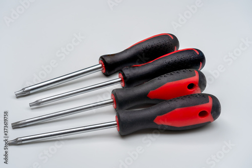 Torx Screwdrivers set with distinct 6 -point star shaped heads on white background known as star screwdrivers or star bits photo