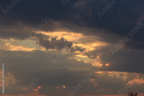 
clouds in the red sunset of a summer evening