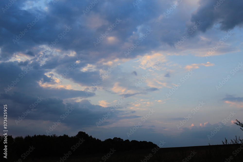 clouds in the red sunset of a summer evening
clouds in the red sunset of a summer evening