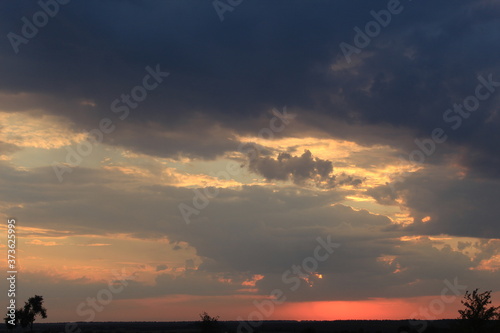 
clouds in the red sunset of a summer evening