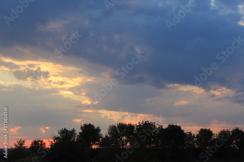 
clouds in the red sunset of a summer evening