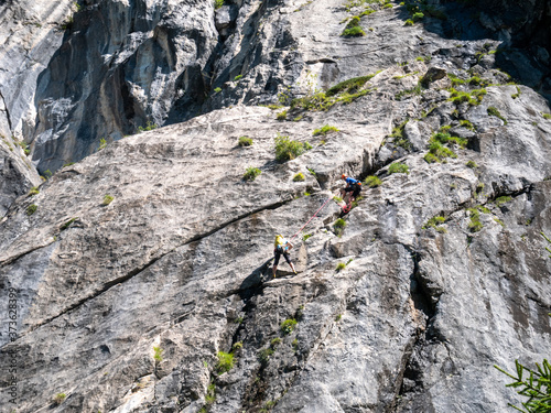 climber on a rock face in the carnic alps