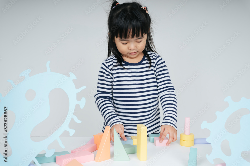 Pretty thai kid woman playing with toy block. Pretty thai kid woman playing with toy block.