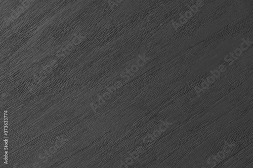 Textured gray painted wooden board close up