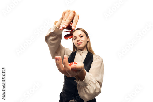 Poker girl. Young woman, croupier gesturing isolated on white background. Highly tensioned, wide angle, fish eye view. Concept of human emotions, facial expression, sales, ad, sport, gambling. photo