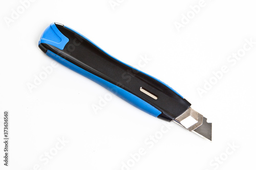 stationery blue and black knife on white background
