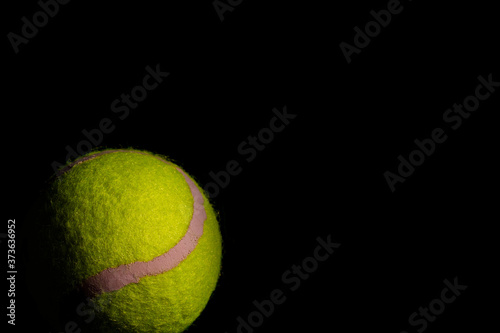Bright Yellow Tennis Ball with dramatic shadows © Sunshine Seeds