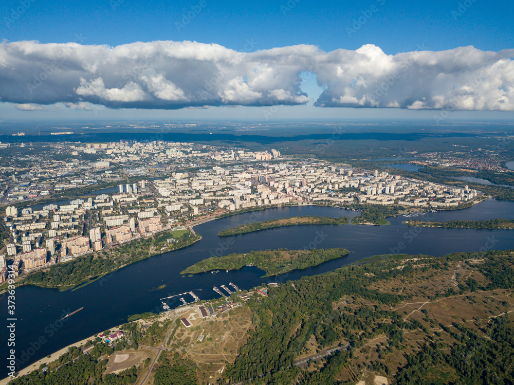 High view of the Dnieper river in Kiev. A cloud over the city.