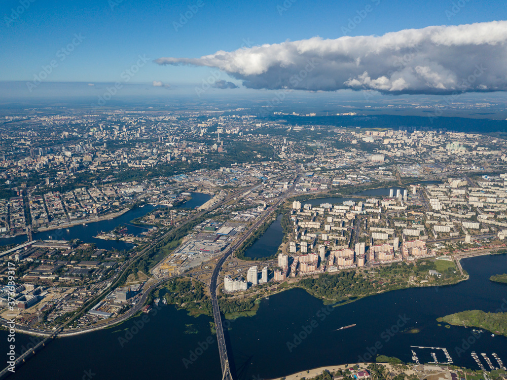 High view of the Dnieper river in Kiev. A cloud over the city.