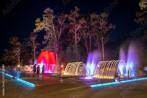 Colored musical water fountain at night. Shekvetili photo