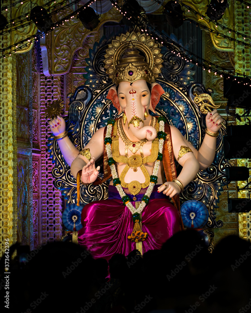 Fototapeta premium Closeup , portrait view of decorated and garlanded idol of Hindu God Ganesha.