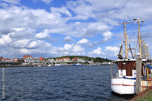 August 22 2020 - Travemuende/Germany: Famous Baltic Sea marina with a lot of berths and a lot of sailing boats in the water against blue sky photo