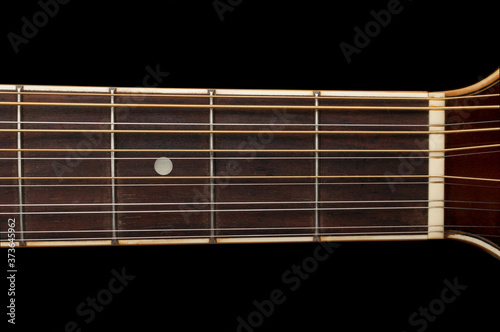 Canvas Print Detail of a 12 string guitar fretboard on black background