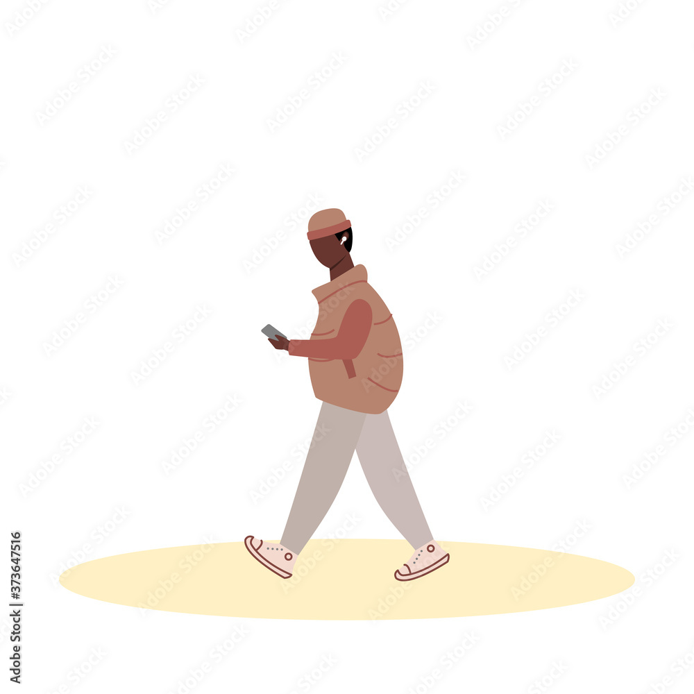 Flat black man in autumn clothes walking and looking at the phone. Cartoon character. Vector illustration.