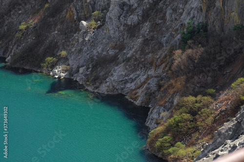 rocky shore and a blue sea view from a hill top