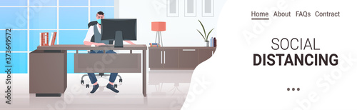 businessman in mask sitting at workplace social distancing coronavirus epidemic protection self isolation remote work concept office interior horizontal full length copy space vector illustration