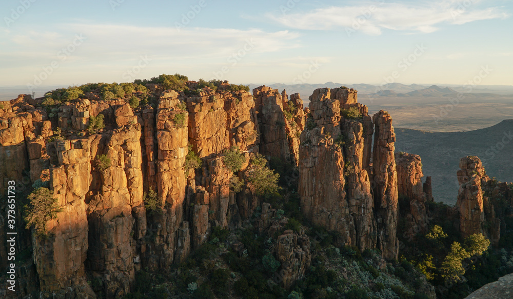 Valley of Desolation Rock Formations and hills during sunset near Graaff Reinet in South Africa.