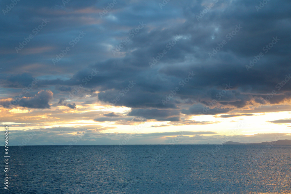 View of the sunset at Namtso lake with dramatic sky, Tibet, China View of the sunset at Namtso lake with dramatic sky, Tibet, China