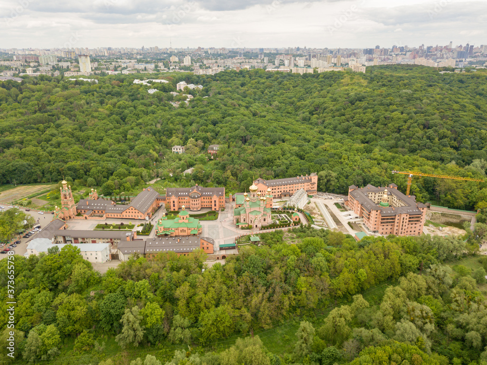 Aerial drone view. Holy Intercession Holosiivsky Monastery. Monastery among the woods in Kiev.