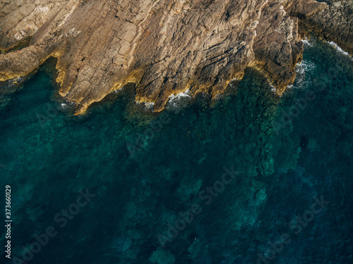 The rocky shore of the Adriatic Sea in Montenegro, aerial top view.