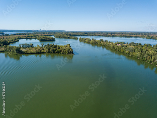 Panoramic view of the Dnieper river in Kiev. Sunny clear day. Aerial drone view.