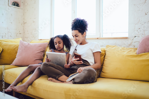 Mother and daughter watching tablet