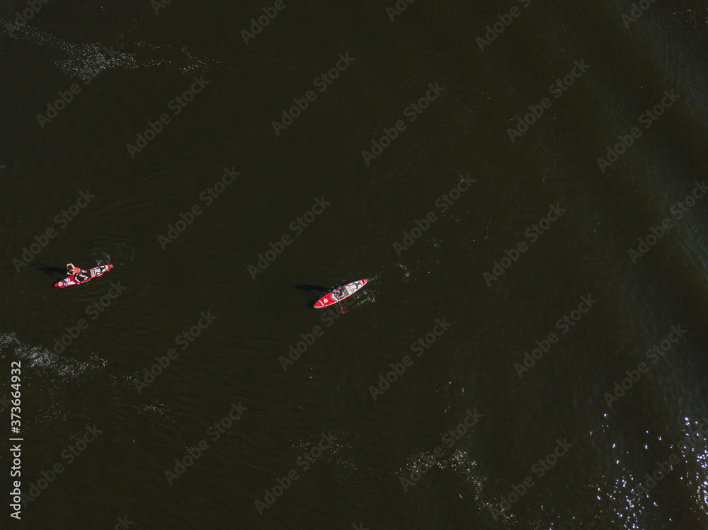 Kayak boat in the green water of the Dnieper river. Aerial drone view. Kayak boat in the green water of the Dnieper river. Aerial drone view.