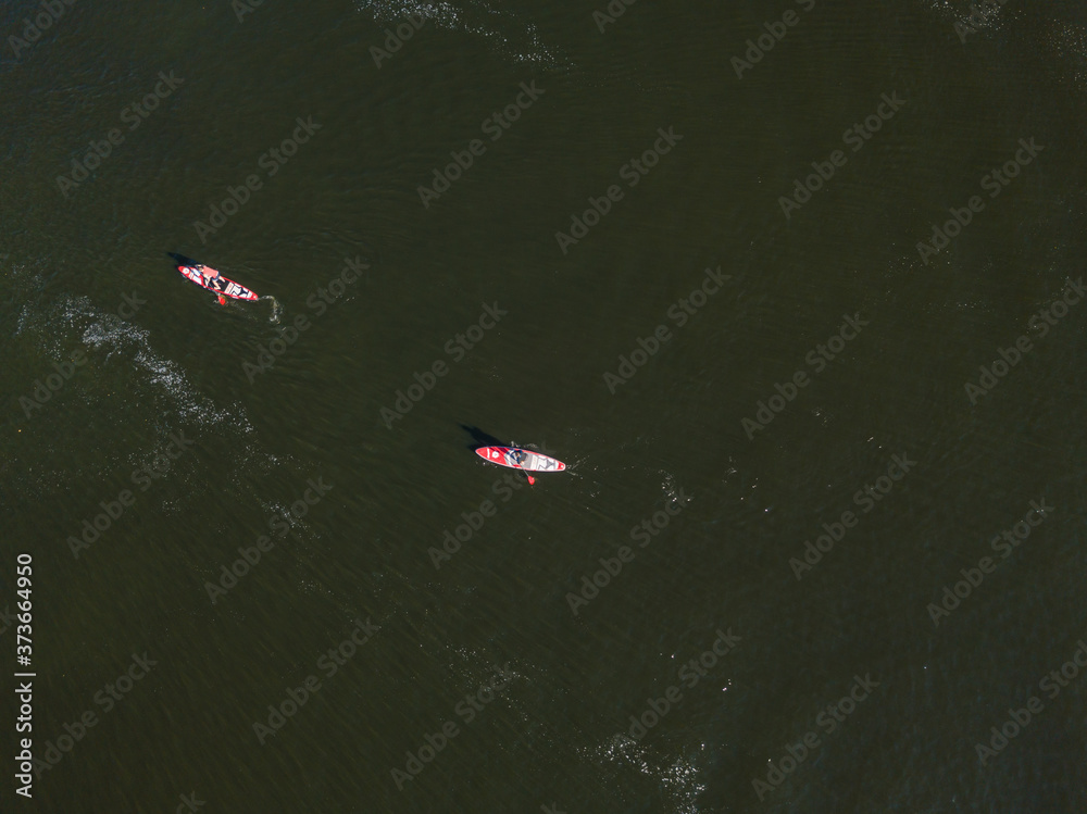 Kayak boat in the green water of the Dnieper river. Aerial drone view. Kayak boat in the green water of the Dnieper river. Aerial drone view.