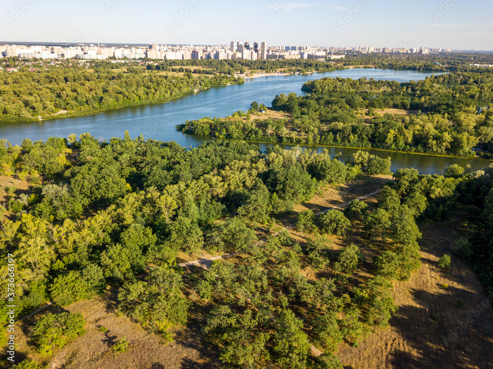 Naklejka premium Panoramic view of the Dnieper river in Kiev. Sunny clear day. Aerial drone view.