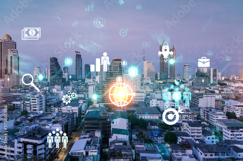 Hologram of Research and Development glowing icons. Sunset panoramic city view of Bangkok. Concept of innovative technologies to create new services and products in Asia. Double exposure.