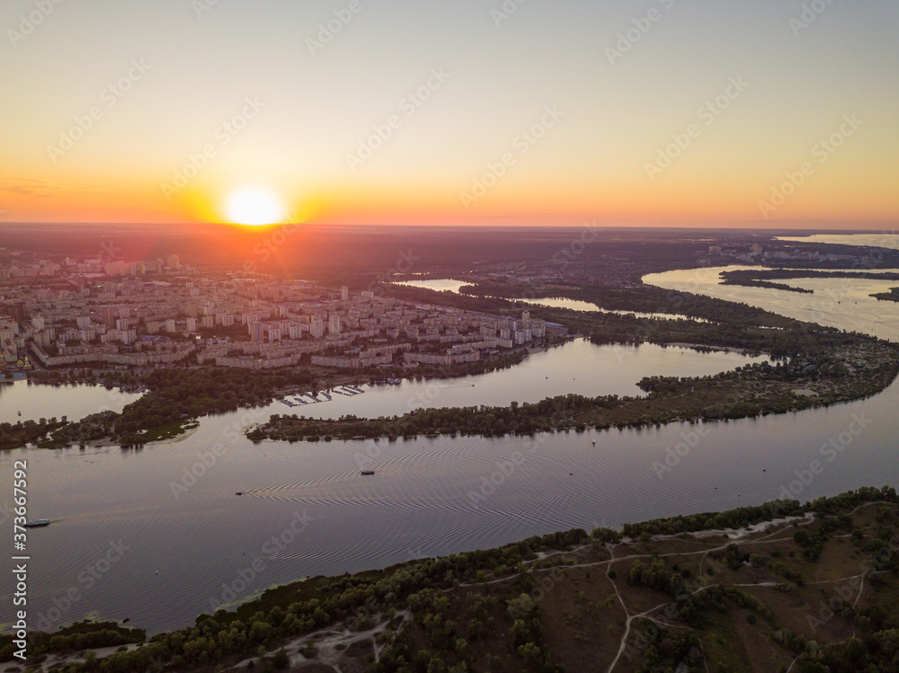 Aerial drone view. Sunset over the Dnieper River and the city of Kiev.