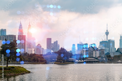 Photography Glowing hologram of Earth planet map on aerial panoramic cityscape of Kuala Lumpur at sunset, Malaysia, Asia