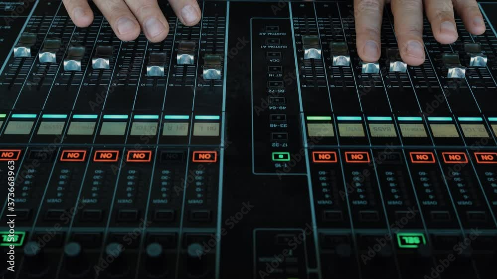 Sound Engineer Moving Sliders In Radio Station. Sound Designer Used Digital Audio Mixer In Production Studio. Soundboard Pads On TV Station. Engineer Press Key Buttons On Control Desk Recording Studio Sound Engineer Moving Sliders In Radio Station. Sound Designer Used Digital Audio Mixer In Production Studio. Soundboard Pads On TV Station. Engineer Press Key Buttons On Control Desk Recording Studio