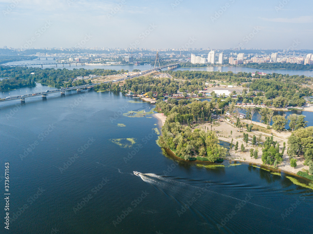Aerial drone view of the Dnieper River in Kiev. Clear sunny day.