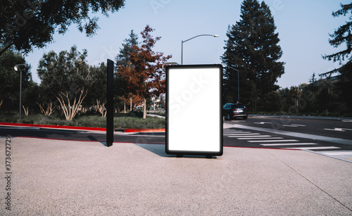 Fototapeta Naklejka Na Ścianę i Meble -  Street billboard with blank copy space screen for advertising text message or promotional content, empty mock up Lightbox for information, modern clear board poster display in public urban city street