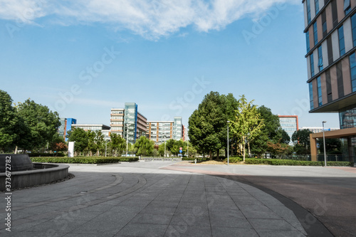 Park with trees and fountains in front of the Business Center