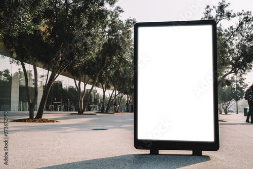 Street billboard with blank copy space screen for advertising text message or promotional content, empty mock up Lightbox for information, modern clear board poster display in public urban city street