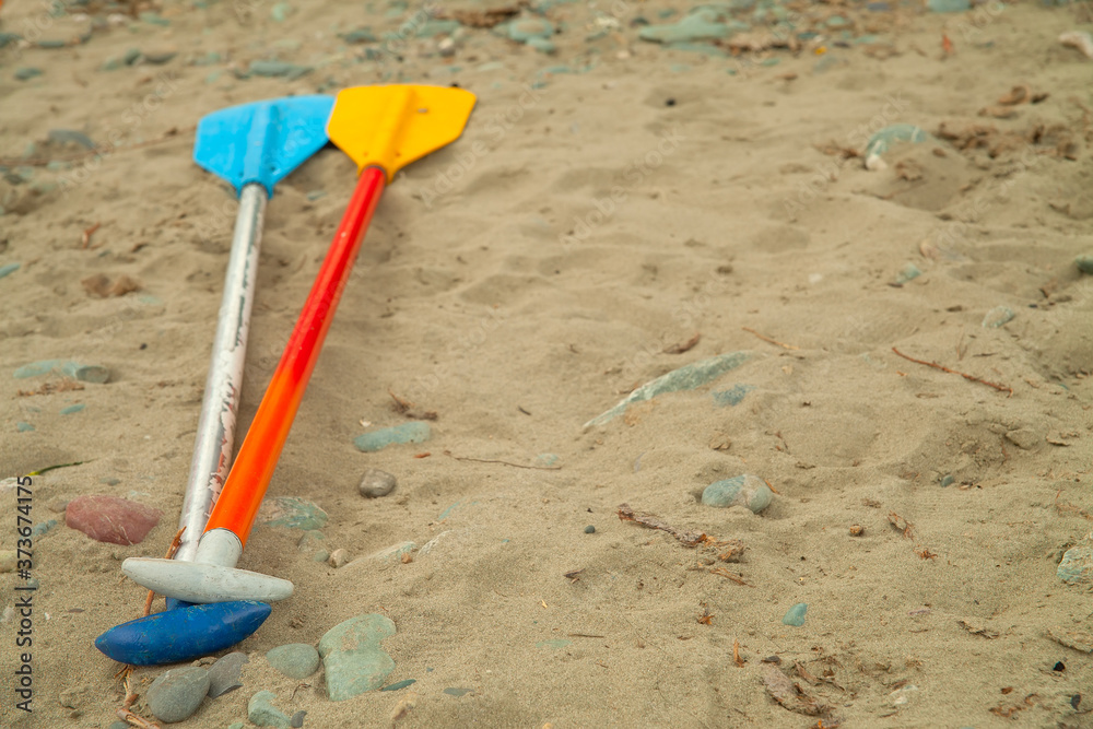 The oars lie on the river sand. Water tourism concept. The oars lie on the river sand. Water tourism concept.