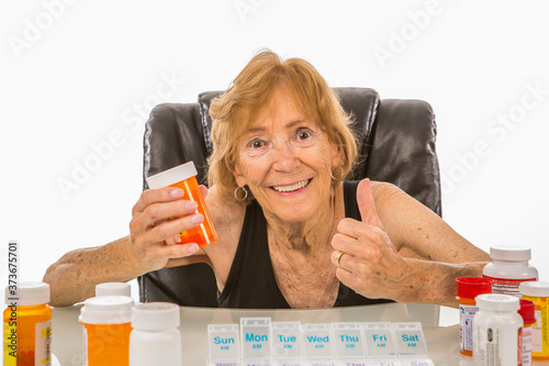 Senior Woman Gives Thumbs Up To Medication She Takes photo