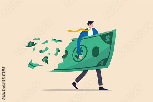 Lose money investment in financial crisis, profit and loss in business or deflation and inflation concept, businessman holding big dollar banknote money while loss, crumble and reduce in value.