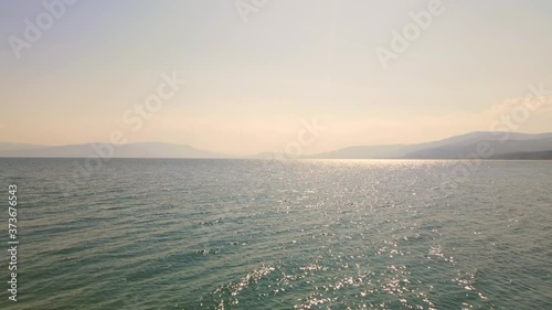 4K aerial drone clip flying backwards over the peninsula  over the beach near Strymonas river in Macedonia, Greece